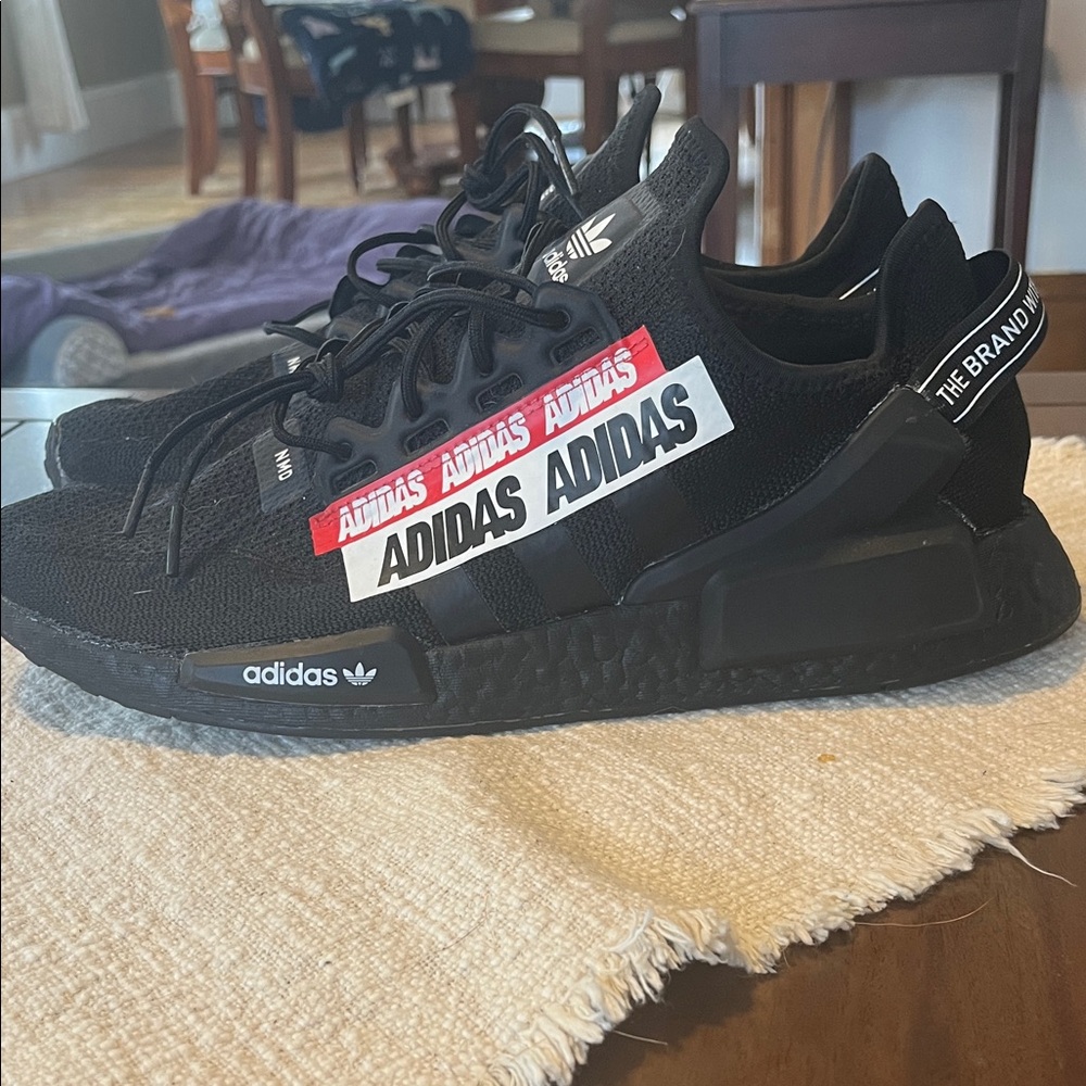 Adidas Triple Black Sneakers with Bold Branding
